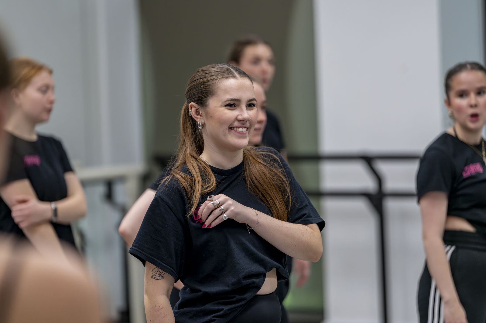 Continuity dancers laughing between rehearsal