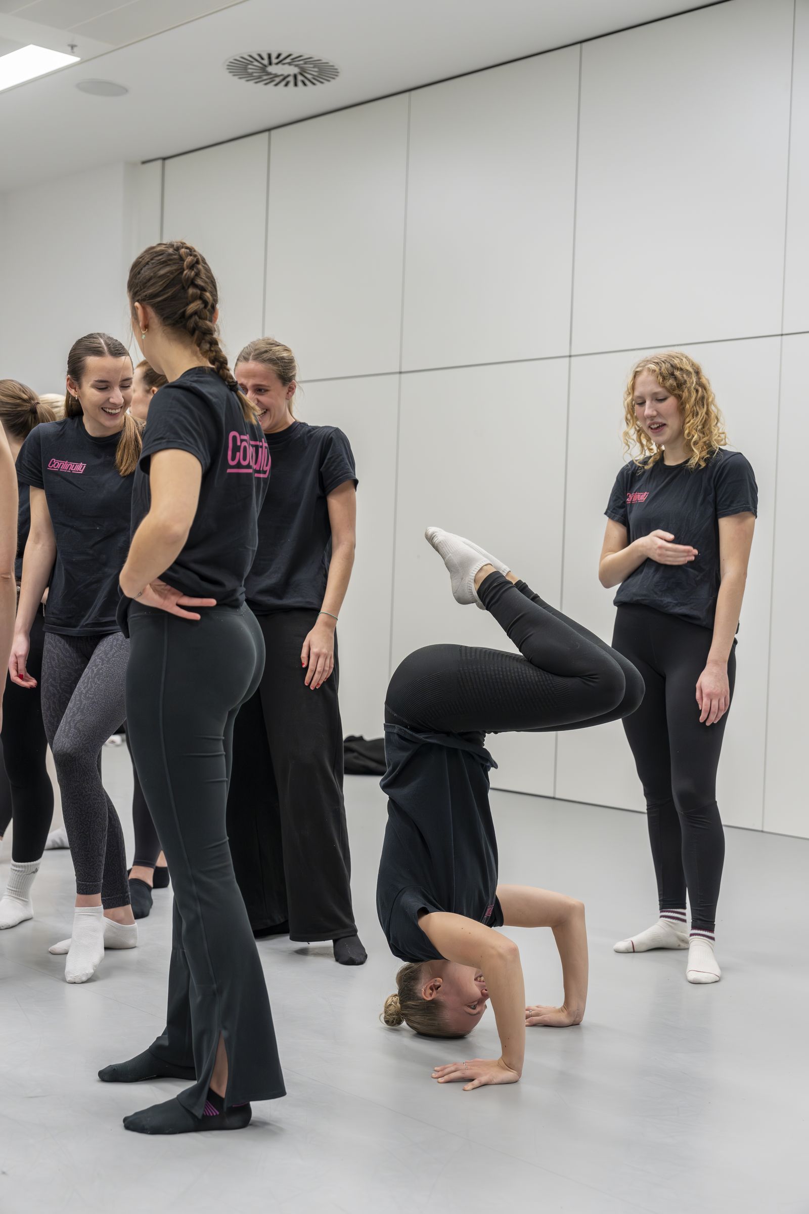 Continuity dancers laughing during rehearsal